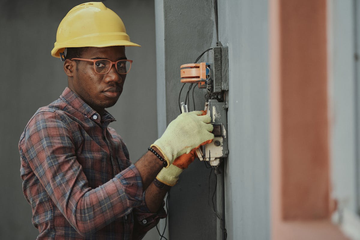 Friendly tradesman checking his phone, happy with his Google rankings