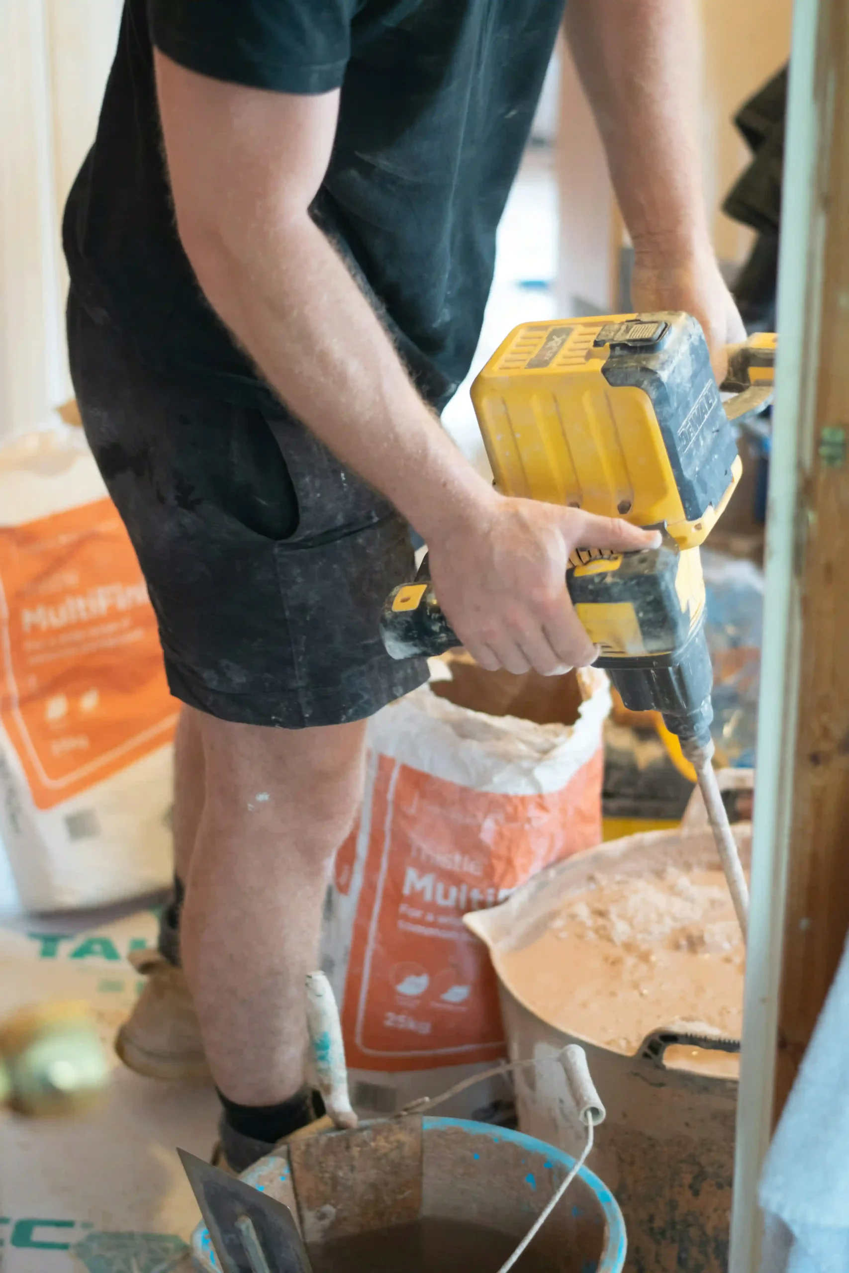 Plasterer skimming an interior wall