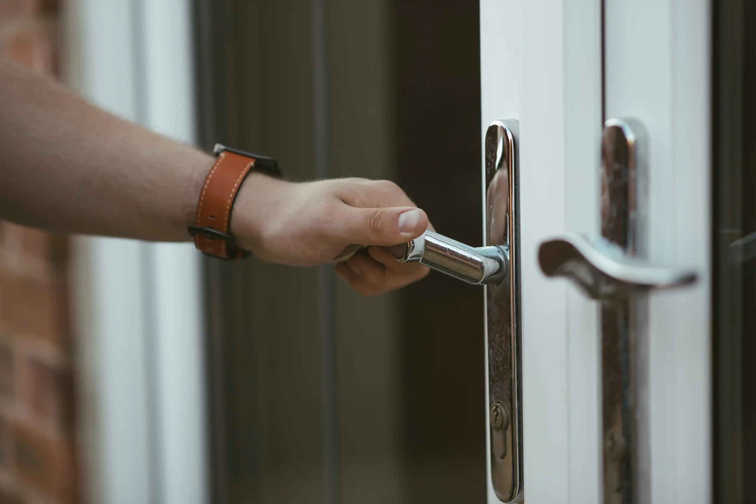Locksmith helping client with locked door open it